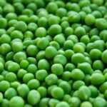 A vibrant close-up image of fresh, organic green peas for healthy eating.